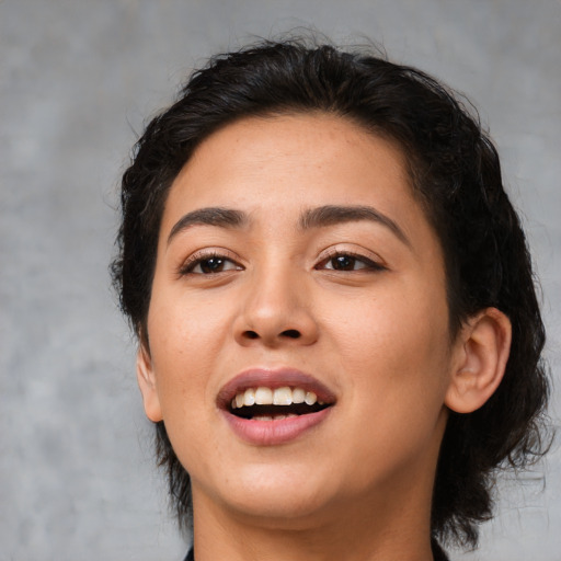 Joyful white young-adult female with medium  black hair and brown eyes