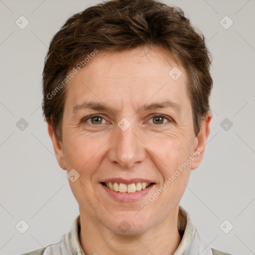 Joyful white adult male with short  brown hair and grey eyes