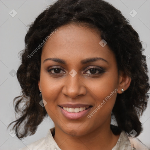 Joyful black young-adult female with medium  brown hair and brown eyes