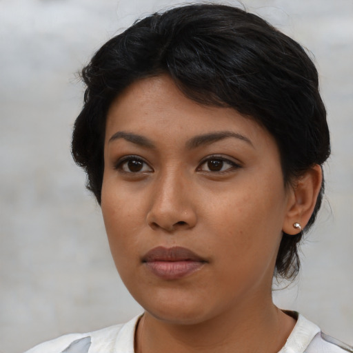 Neutral latino young-adult female with medium  brown hair and brown eyes