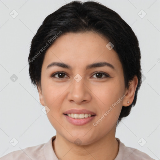 Joyful latino young-adult female with short  black hair and brown eyes