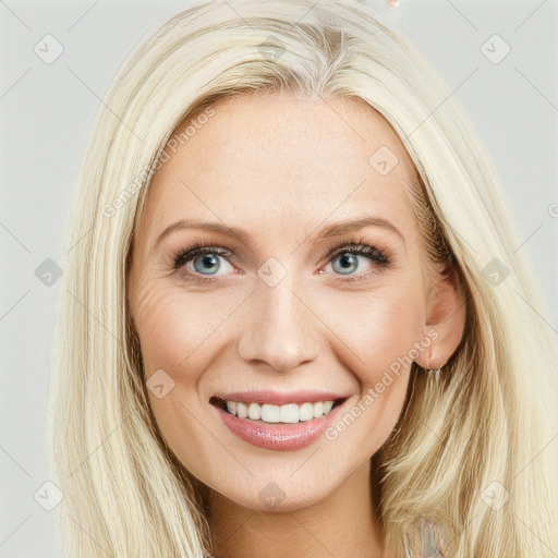 Joyful white young-adult female with long  brown hair and blue eyes