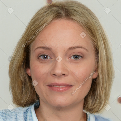 Joyful white young-adult female with medium  brown hair and blue eyes