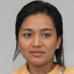 Joyful asian young-adult female with medium  brown hair and brown eyes