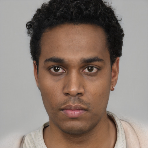 Neutral black young-adult male with short  black hair and brown eyes