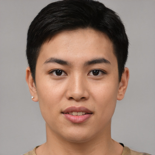 Joyful asian young-adult female with short  black hair and brown eyes