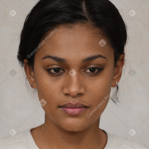 Joyful black young-adult female with short  black hair and brown eyes