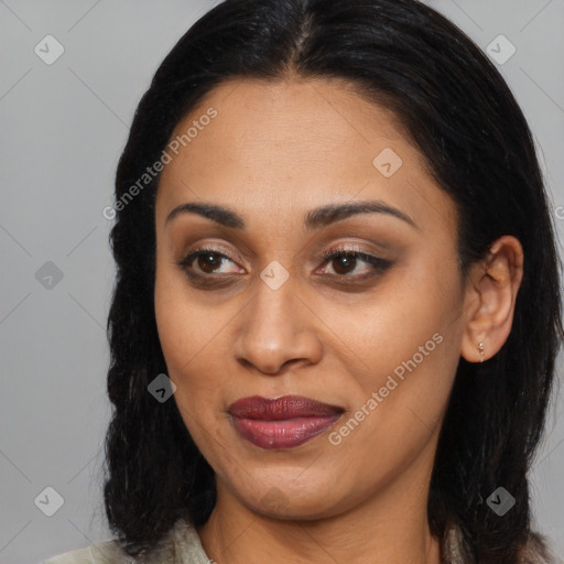 Joyful latino young-adult female with long  brown hair and brown eyes