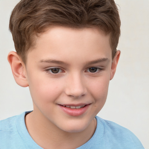 Joyful white child male with short  brown hair and brown eyes