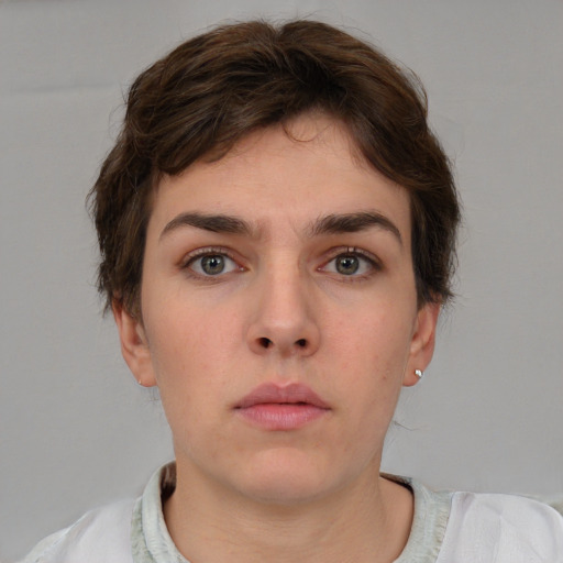 Neutral white young-adult female with short  brown hair and brown eyes