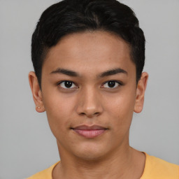 Joyful asian young-adult male with short  black hair and brown eyes