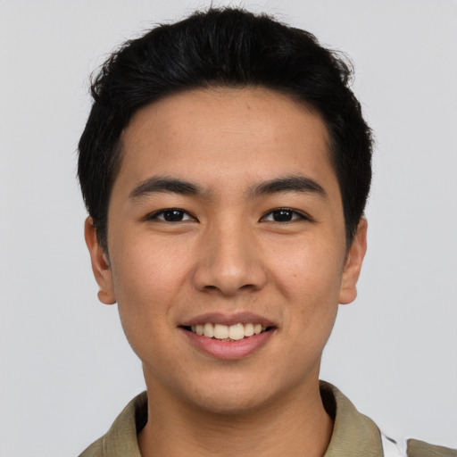 Joyful asian young-adult male with short  black hair and brown eyes