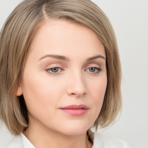 Neutral white young-adult female with medium  brown hair and grey eyes