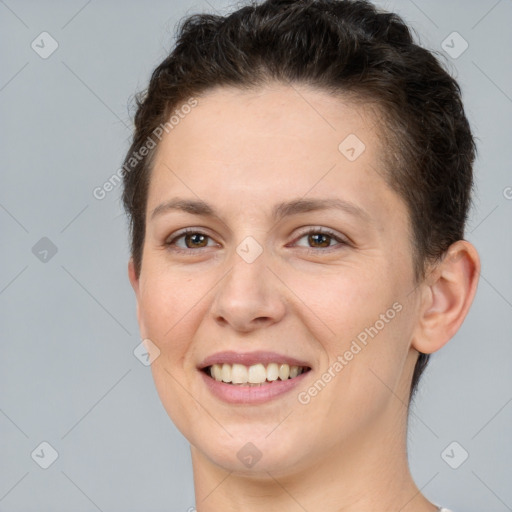 Joyful white young-adult female with short  brown hair and brown eyes