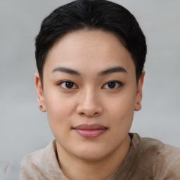 Joyful asian young-adult female with short  black hair and brown eyes