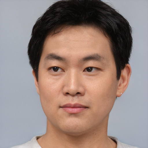 Neutral asian young-adult male with short  brown hair and brown eyes