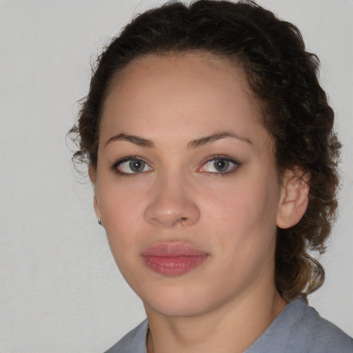 Neutral black young-adult female with medium  brown hair and brown eyes