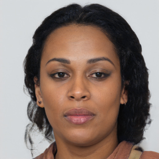Neutral asian adult female with medium  black hair and brown eyes