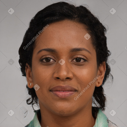 Joyful black young-adult female with medium  brown hair and brown eyes