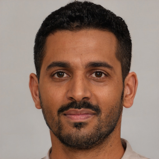Neutral black young-adult male with short  black hair and brown eyes