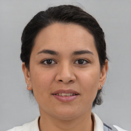 Joyful asian young-adult female with medium  brown hair and brown eyes