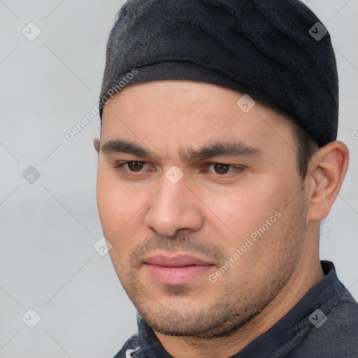 Joyful white young-adult male with short  black hair and brown eyes