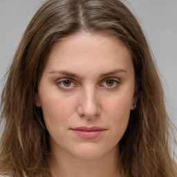 Joyful white young-adult female with long  brown hair and green eyes