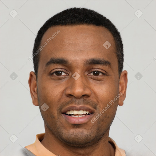 Joyful black young-adult male with short  black hair and brown eyes