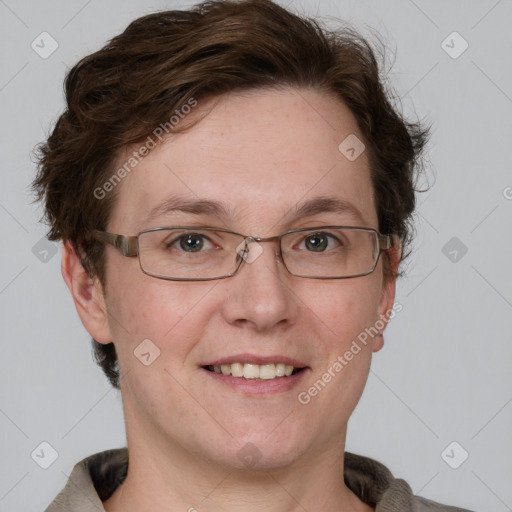 Joyful white adult female with short  brown hair and grey eyes