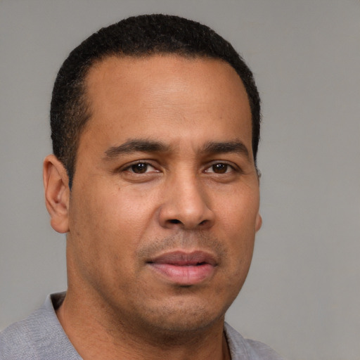 Neutral latino young-adult male with short  brown hair and brown eyes