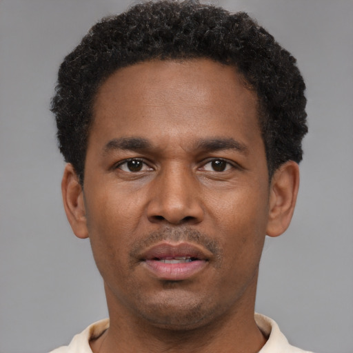 Neutral black young-adult male with short  brown hair and brown eyes