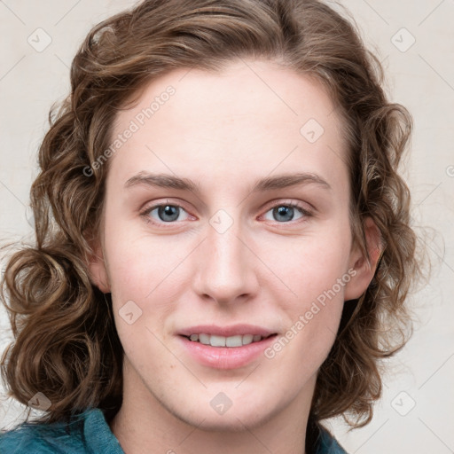 Joyful white young-adult female with medium  brown hair and blue eyes