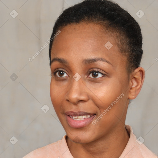 Joyful black young-adult female with short  black hair and brown eyes