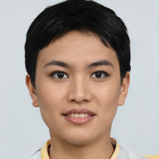 Joyful asian young-adult female with short  black hair and brown eyes
