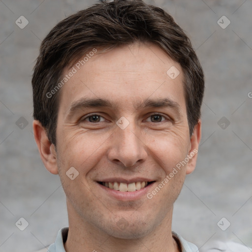 Joyful white adult male with short  brown hair and grey eyes