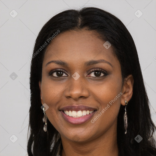 Joyful black young-adult female with long  brown hair and brown eyes