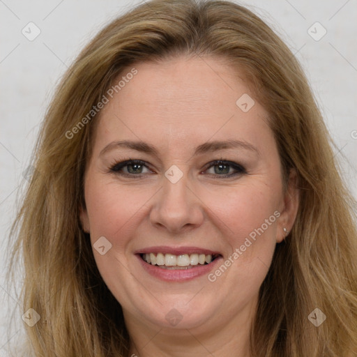 Joyful white adult female with long  brown hair and brown eyes