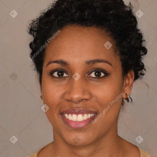 Joyful black young-adult female with short  brown hair and brown eyes