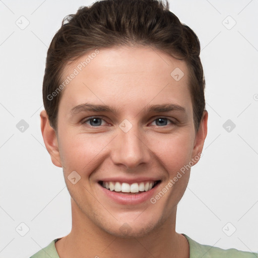 Joyful white young-adult female with short  brown hair and grey eyes