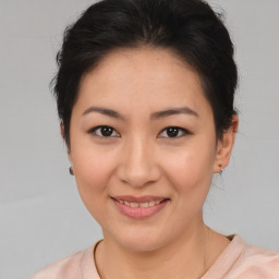 Joyful asian young-adult female with medium  brown hair and brown eyes