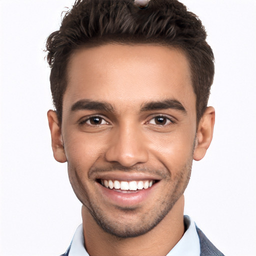 Joyful white young-adult male with short  black hair and brown eyes