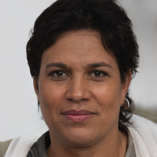 Joyful white adult female with short  brown hair and brown eyes