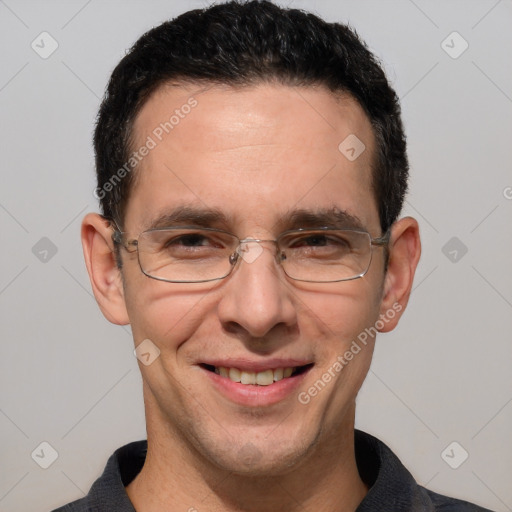 Joyful white adult male with short  brown hair and brown eyes