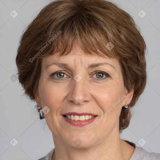 Joyful white adult female with medium  brown hair and grey eyes