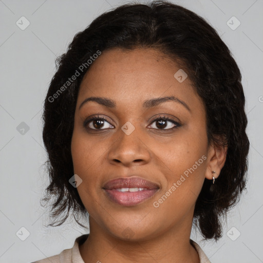 Joyful black adult female with medium  brown hair and brown eyes