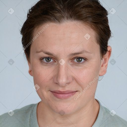 Joyful white adult female with short  brown hair and grey eyes