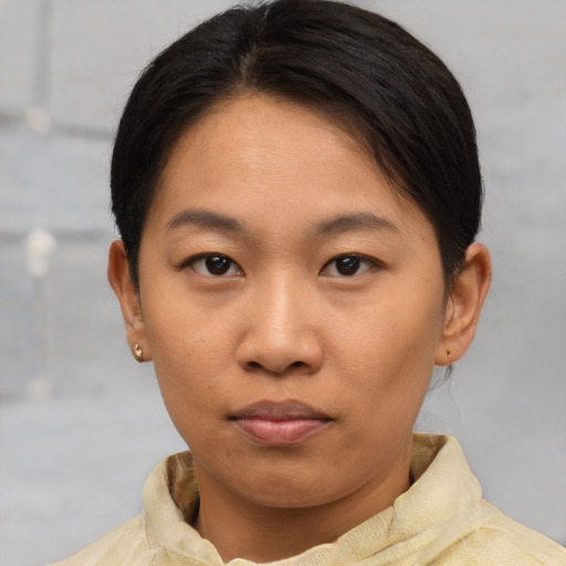 Neutral asian young-adult female with short  brown hair and brown eyes