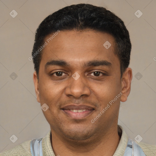 Joyful black young-adult male with short  black hair and brown eyes