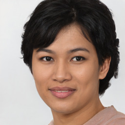 Joyful asian young-adult female with short  black hair and brown eyes