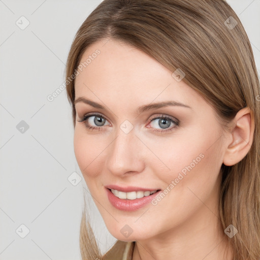 Joyful white young-adult female with long  brown hair and blue eyes